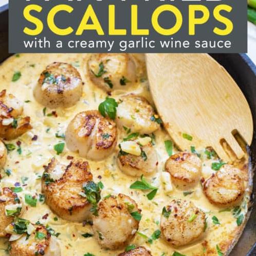  The aroma of garlic and white wine wafting through your kitchen is heavenly, especially when it's paired with perfectly seared scallops.