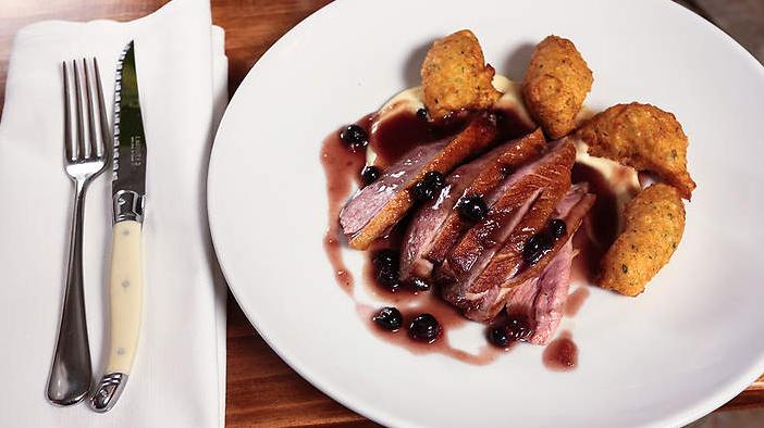  The crispy skin adds a perfect texture to the tender duck meat.