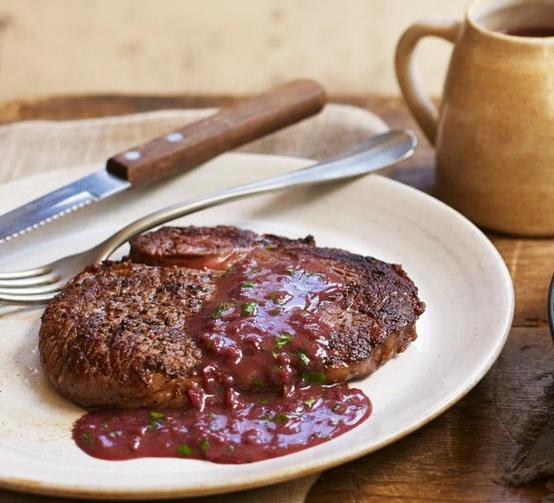  The deep red color of the wine sauce is a beautiful contrast to the golden brown steak.