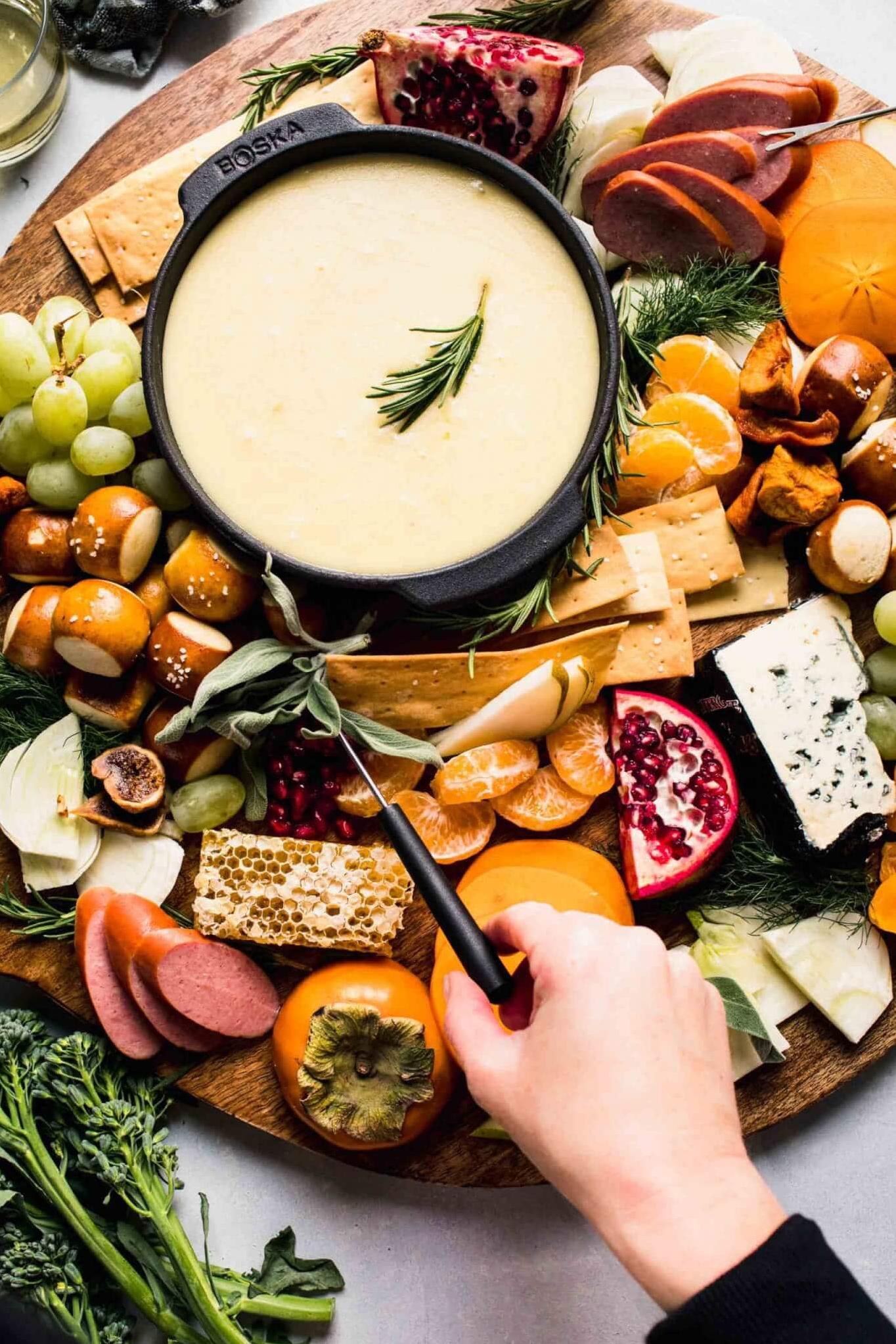  The melting pot of cheese and wine is the perfect combination for a cozy night in with friends or family.