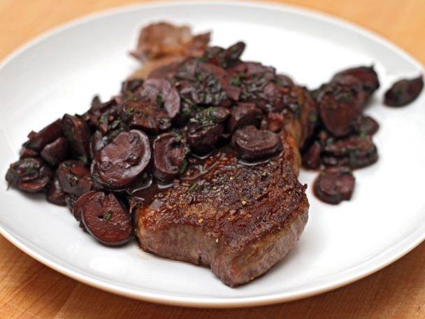  The mushrooms are sautéed with shallots, garlic, and thyme, making for a delicious side to the steak.