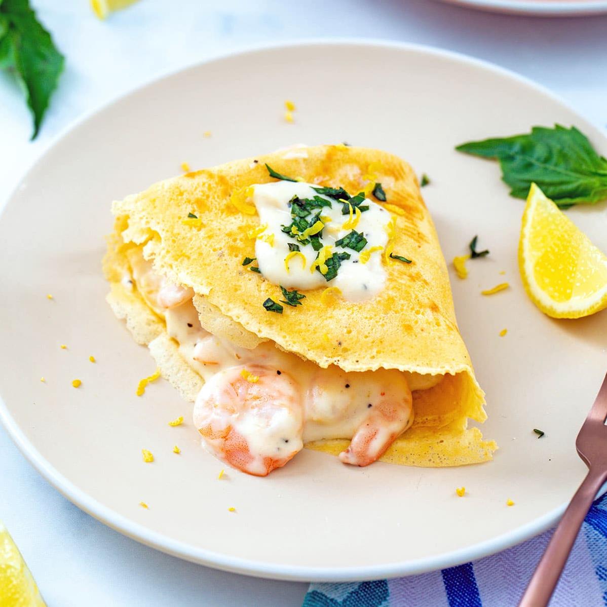  The perfect combination of creamy cheese, succulent seafood, and delicate crepes - a match made in food heaven.