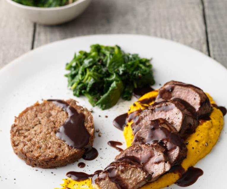  The perfect combination of flavors: lamb, red wine sauce, and carrot puree.