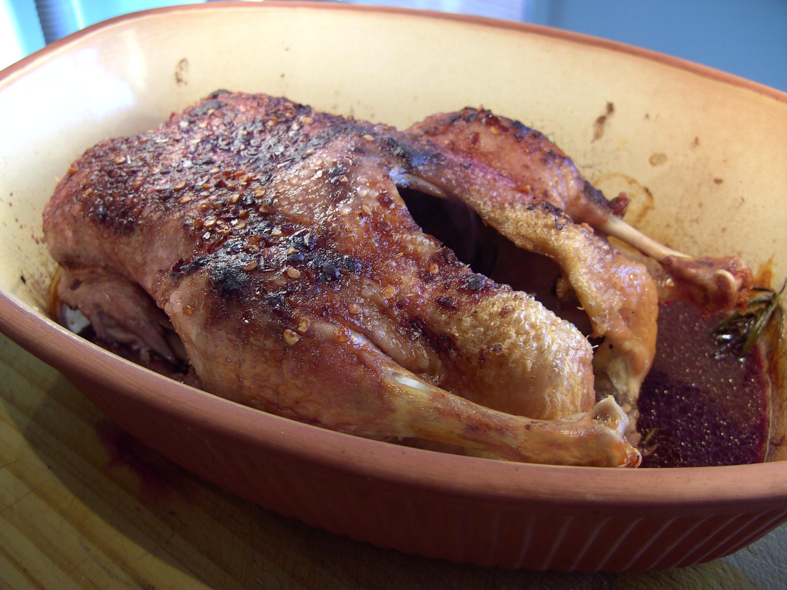  The rich, deep color of the red wine sauce perfectly complements the tender, crispy skin of the duck leg
