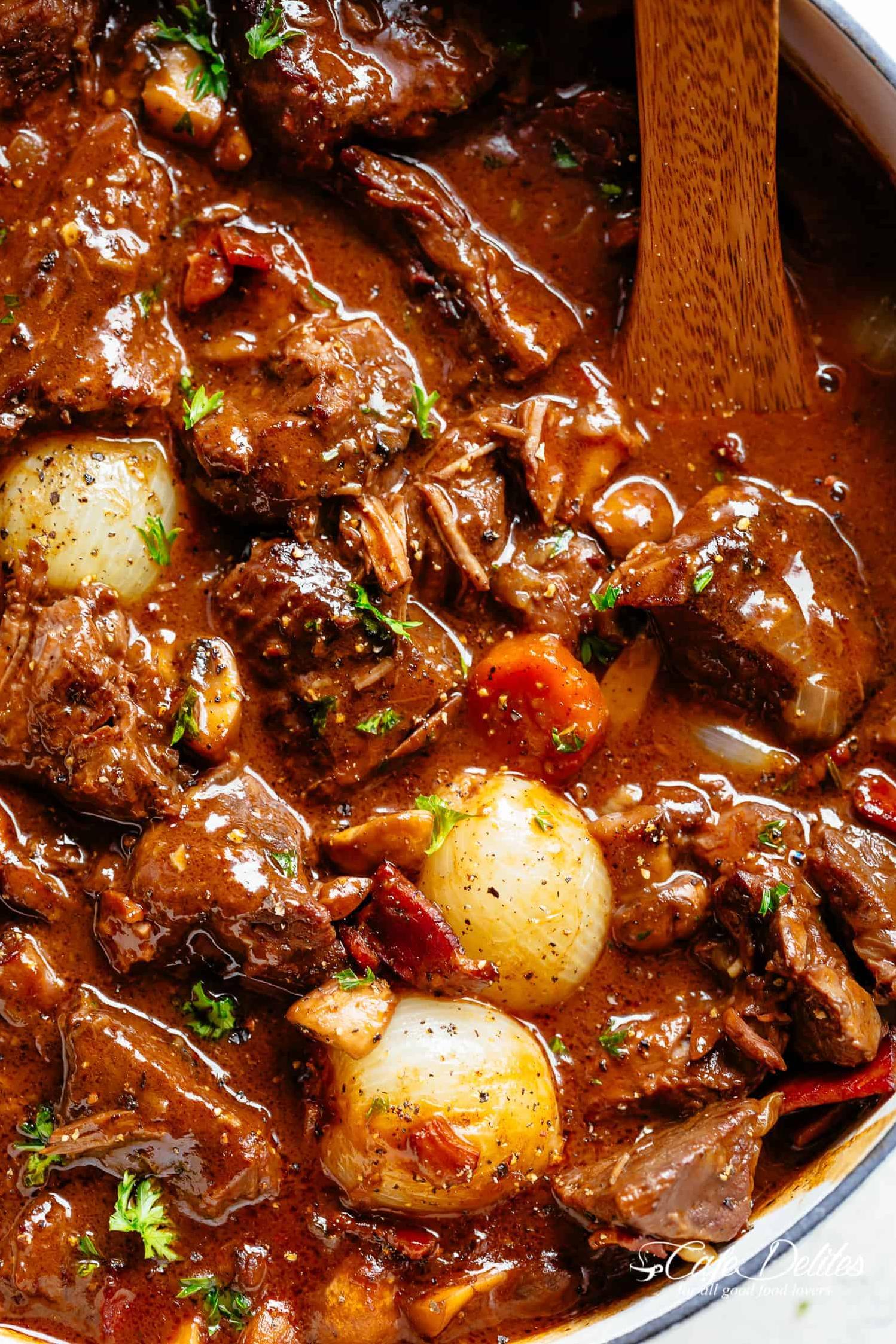  The tender beef is cooked to perfection in red wine, giving it a melt-in-your-mouth texture.