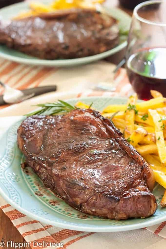  This marinade isn't just for the bottle - the addition of red wine gives these New York steaks a juicy, tender texture that's hard to resist.