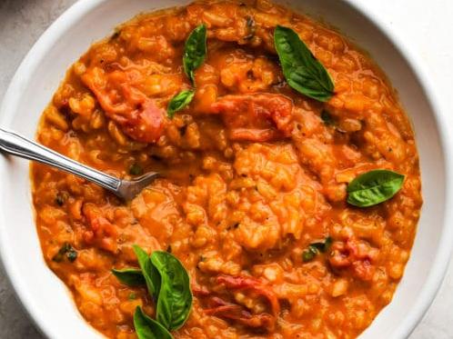  This risotto recipe combines the best of both worlds: tomatoes and wine.